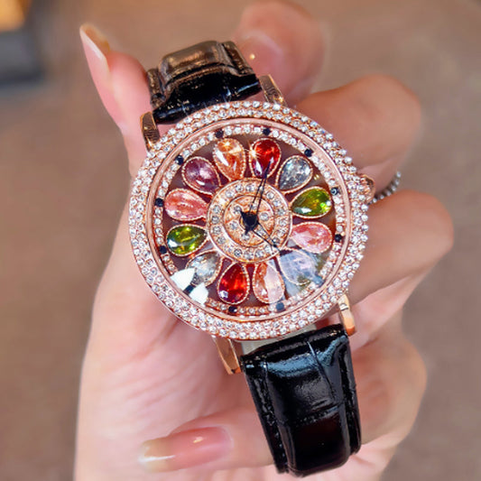 Dameshorloge met draaiende wijzerplaat en gekleurde gesimuleerde diamanten