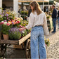Damesjeans met wijde pijpen en opgestikte zakke